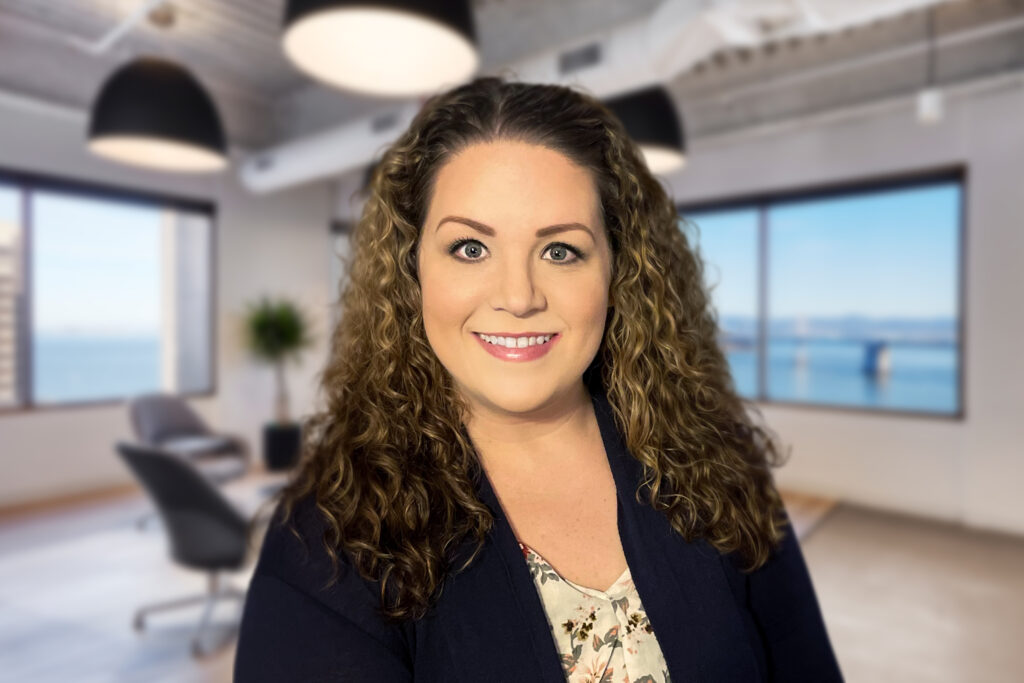 woman-with-curly-hair-standing-in-office